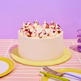 Classic Red Velvet Cake by Crumbs & Doilies with smooth cream cheese frosting and red velvet crumb decoration.